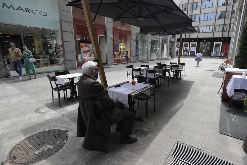 A man sits at a restaurant in Milan, Italy, during the pandemic. (AP)