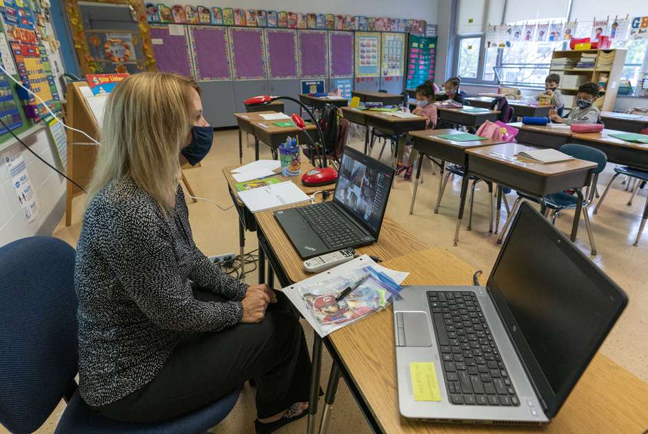 A teacher in Yonkers, New York teaches first grade in person and remotely during the coronavirus pandemic. (Mary Altaffer, AP)