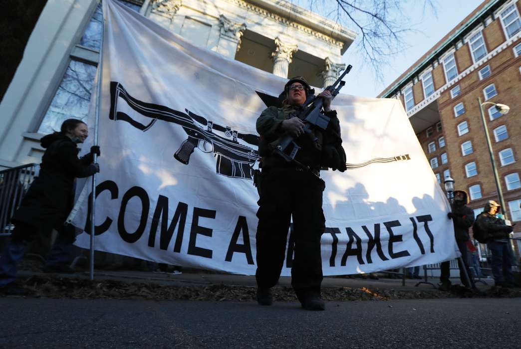 Background checks hit a new record nationwide in 2020. (AP Photo/Julio Cortez)