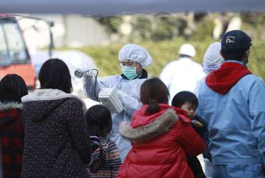 Residents evacuated from areas surrounding the tsunami-crippled Fukushima Dai-ichi nuclear power plant are checked for radiation exposure in Koriyama, Fukushima Prefecture, northeastern Japan. (AP Photo/Wally Santana)