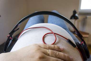 Babies are are able to respond to different sounds in the womb. Does that make them conscious before birth? (Shutterstock)
