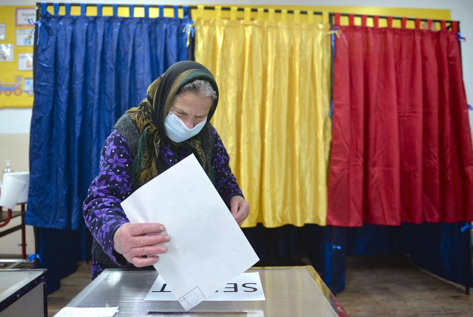 Party polarization can keep ambivalent voters away from the polls. (AP Photo/Alexandru Dobre)