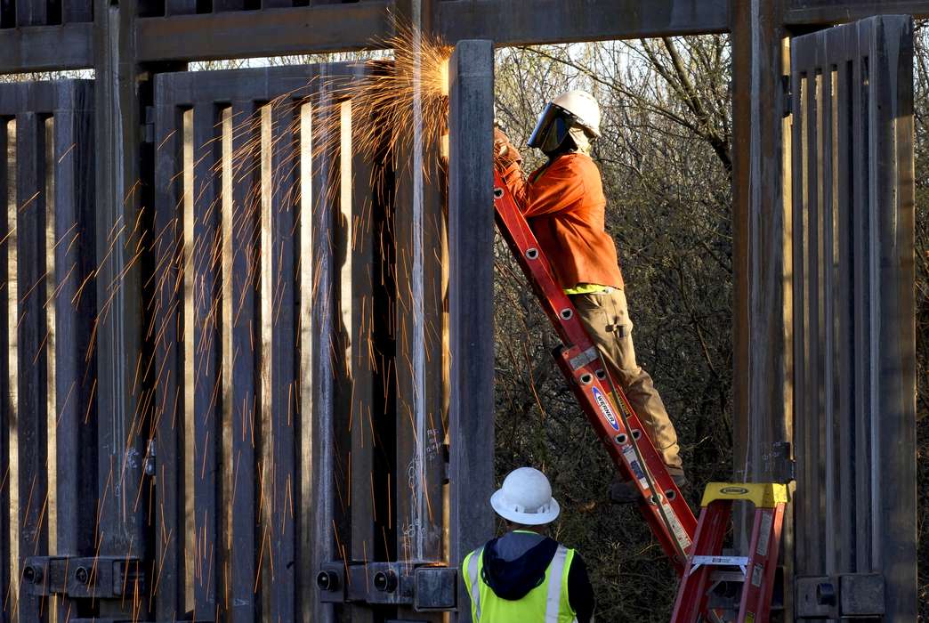 The border wall was just one example of Trump's isolationist policies. (AP Photo/Matt York)